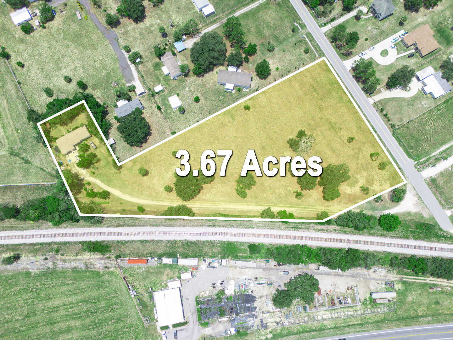 Aerial view of 2300 Olsen Road with the 3.67-acre parcel boundary outlined