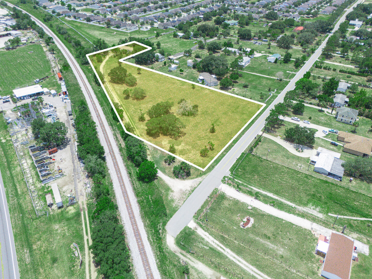 Wide aerial with rail and surrounding homes